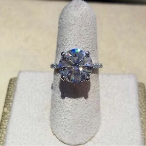 Platinum ring with genuine diamonds set with a 4 carat moissanite
